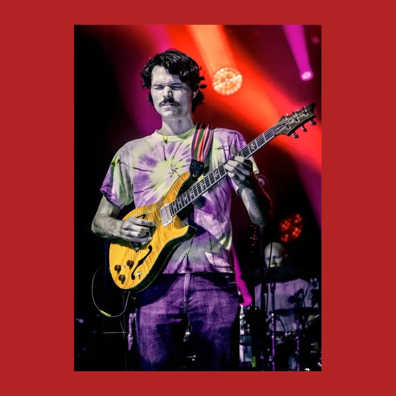 Guitarist Performing on Colorfully Lit Concert Stage